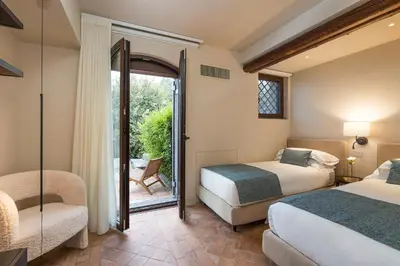 Letto o letti in una camera di Villa Continella
