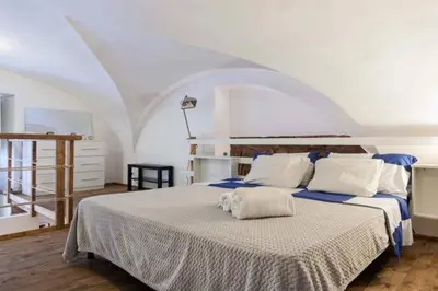 Letto o letti in una camera di La Salita Di San Camillo