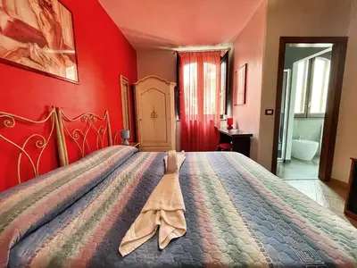 Letto o letti in una camera di B&B Epos Acitrezza