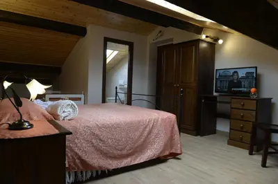 Letto o letti in una camera di B&B San Leonardo