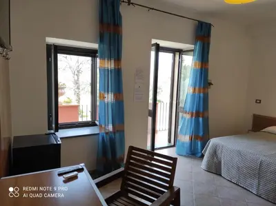 Letto o letti in una camera di Agriturismo dell'Etna