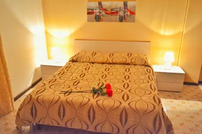 Letto o letti in una camera di B&B Lungomare