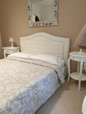 Letto o letti in una camera di Dimoramuri B&B