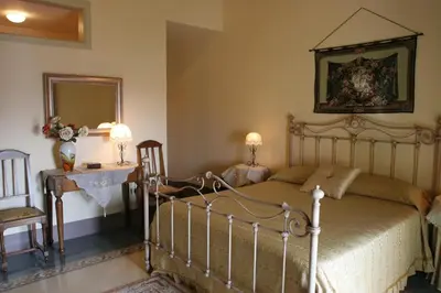 Letto o letti in una camera di B&B Palazzo Gambino