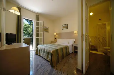 Letto o letti in una camera di Hotel Borgo Verde