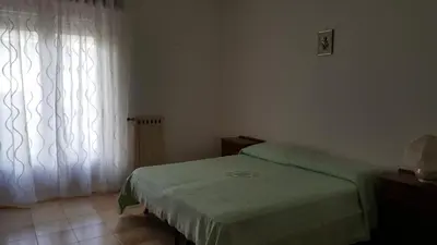 Letto o letti in una camera di Tra L'Etna e il Mare