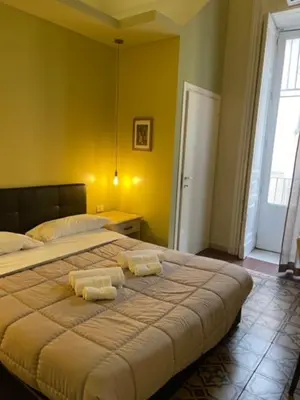 Letto o letti in una camera di Umberto House Catania