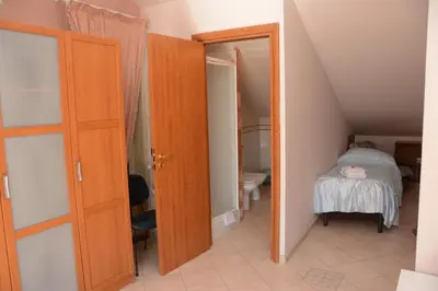 Letto o letti in una camera di B&B Villa San Leonardo
