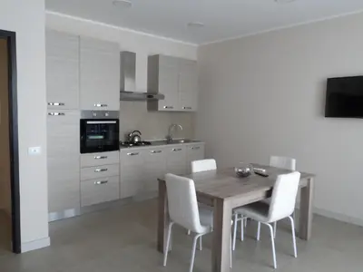 Cucina o angolo cottura di Residence Palazzo dei Delfini by RECEPTIO