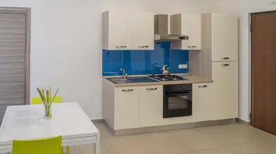 Cucina o angolo cottura di Residence Palazzo dei Delfini by RECEPTIO