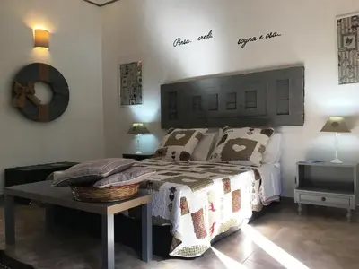 Letto o letti in una camera di Nzina Maison de Charme