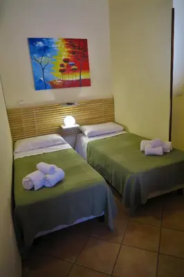 Letto o letti in una camera di Cortile dei Sogni