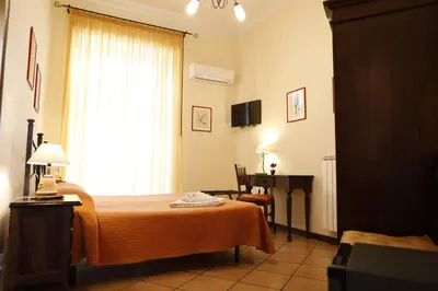 Letto o letti in una camera di B&B Del Corso
