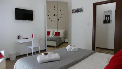 Letto o letti in una camera di B&B Fusorario