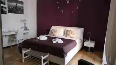 Letto o letti in una camera di B&B Fusorario