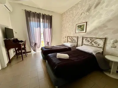 Letto o letti in una camera di TK HOTEL - ex Ares