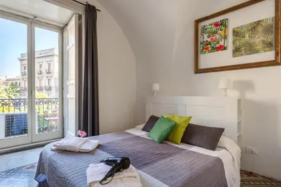 Letto o letti in una camera di Da Gianni e Lucia Rooms with bathroom in the city center