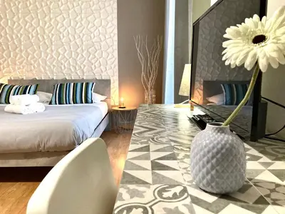 Letto o letti in una camera di Stesicoro InHabit