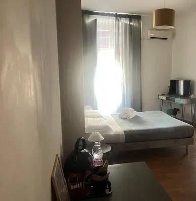 Letto o letti in una camera di Stesicoro InHabit