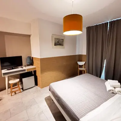 Letto o letti in una camera di Stesicoro InHabit