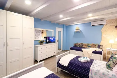 Letto o letti in una camera di Casa della Perla, Parcheggio disponibile, centrale