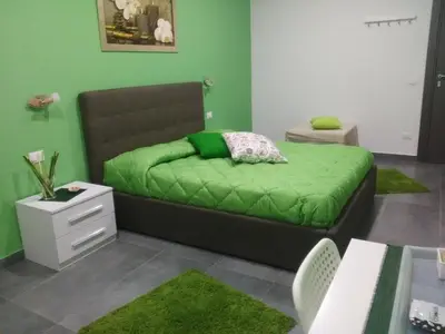 Letto o letti in una camera di B&B La Grotta