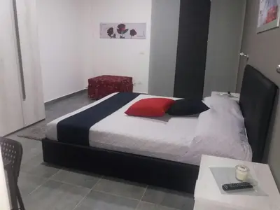 Letto o letti in una camera di B&B La Grotta