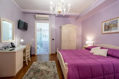 Letto o letti in una camera di Alhambra Guest House di Charme