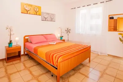 Letto o letti in una camera di STELLA MARINA Beach&Pool Catania Taormina Etna District