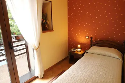 Letto o letti in una camera di Hotel Alle Pendici