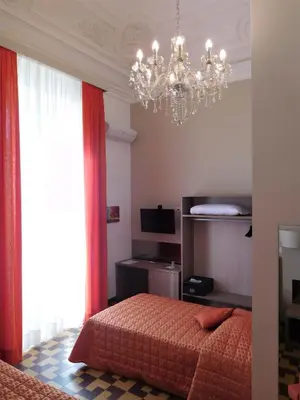 Letto o letti in una camera di Hotel Etnea Royal Suites
