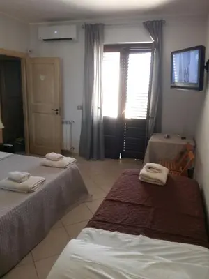Letto o letti in una camera di B&B Lavinaio