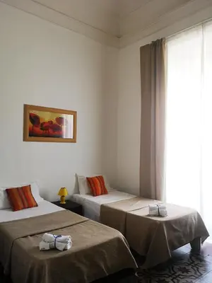 Letto o letti in una camera di Hotel Valentino