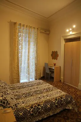 Letto o letti in una camera di Cortile Stesicoro