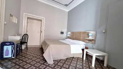 Letto o letti in una camera di Cortile Stesicoro