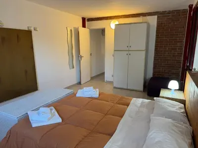 Letto o letti in una camera di Villa Rama