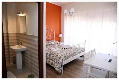 Letto o letti in una camera di Tosca B&B