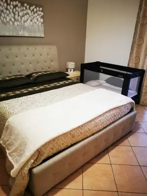 Letto o letti in una camera di Casa Donna Rosaria tra Etna e Taormina