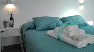 Letto o letti in una camera di Tivoli ShortLets - Catania