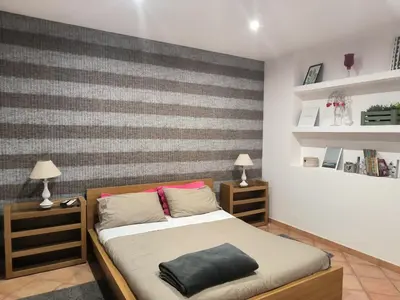 Letto o letti in una camera di Etna Holidays Home SereLeo