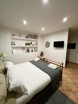 Letto o letti in una camera di Etna Holidays Home SereLeo