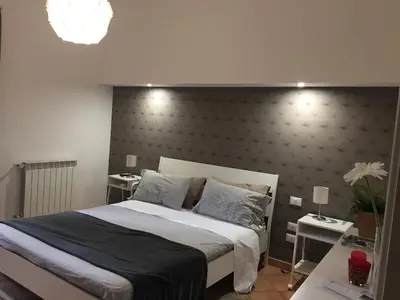 Letto o letti in una camera di Etna Holidays Home SereLeo
