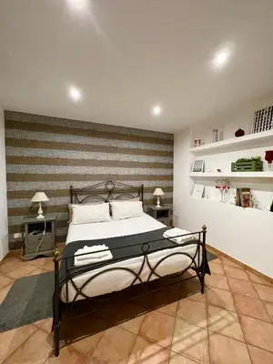 Letto o letti in una camera di Etna Holidays Home SereLeo