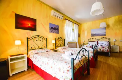 Letto o letti in una camera di B&B Alfio Tomaselli