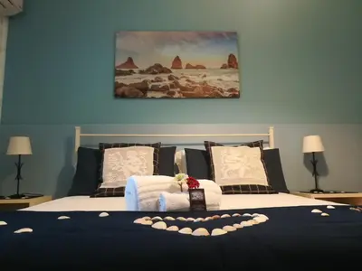 Letto o letti in una camera di B&B Alfio Tomaselli
