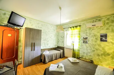 Letto o letti in una camera di B&B Alfio Tomaselli