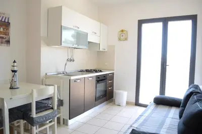 Cucina o angolo cottura di Suite Riviera - comfort moderno vicino al mare