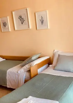 Letto o letti in una camera di Torre Archirafi Vacanze