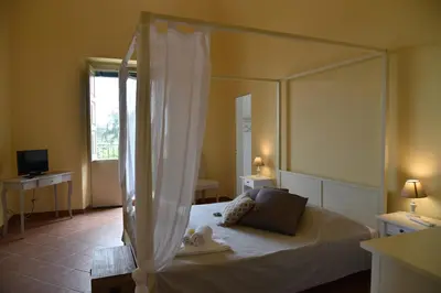 Letto o letti in una camera di Giardino Arancio