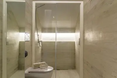 Bagno di Les Suites - Apartments